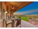 Covered patio with seating area and stunning sunset views at 2736 Hartwick Pines Dr, Henderson, NV 89052