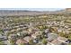 Aerial view of homes in a residential neighborhood with mountain views at 3817 Honey Ridge Ct, Las Vegas, NV 89135