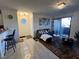 Open living area with seating and access to kitchen and patio at 4050 Pacific Harbors Dr # 133, Las Vegas, NV 89121