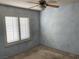 Bedroom with light blue walls and plantation shutters at 4454 Harmony Ct, Las Vegas, NV 89121