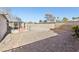 Low maintenance gravel backyard with brick walk way and block wall at 5396 Chestnut St, Las Vegas, NV 89119