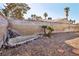 Easy care backyard with unique water feature and block wall at 5396 Chestnut St, Las Vegas, NV 89119