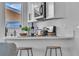 Updated kitchen featuring stainless steel microwave and white shaker cabinets at 5512 Burntwood Way, Las Vegas, NV 89108