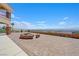 Landscaped backyard with a fire pit and a panoramic view at 7192 Polita Ct, Las Vegas, NV 89156