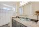 Bathroom with granite vanity, glass vessel sink, and shower at 7192 Polita Ct, Las Vegas, NV 89156