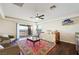 Bedroom with sitting area, access to balcony, and mountain views at 7192 Polita Ct, Las Vegas, NV 89156