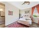 Well-lit bedroom with ensuite bathroom access at 7192 Polita Ct, Las Vegas, NV 89156