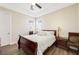 Comfortable bedroom with a sleigh bed and ceiling fan at 7192 Polita Ct, Las Vegas, NV 89156