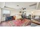 Spacious bedroom with a wet bar and sitting area at 7192 Polita Ct, Las Vegas, NV 89156