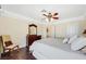 Comfortable bedroom with ensuite bathroom access and large dresser at 7192 Polita Ct, Las Vegas, NV 89156