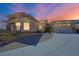 Two-story house with a three-car garage and a circular driveway at 7192 Polita Ct, Las Vegas, NV 89156