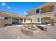 Circular fire pit with stone seating at 7192 Polita Ct, Las Vegas, NV 89156