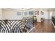 Upper hallway with hardwood floor and elegant railing at 7192 Polita Ct, Las Vegas, NV 89156