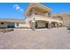 Two-story home with stone accents and balconies at 7192 Polita Ct, Las Vegas, NV 89156