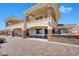 Two-story home with stone accents and balconies at 7192 Polita Ct, Las Vegas, NV 89156