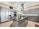 Spacious kitchen featuring a large island and gray cabinets at 7192 Polita Ct, Las Vegas, NV 89156