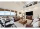 Spacious living room with high ceilings, large windows, and stunning views at 7192 Polita Ct, Las Vegas, NV 89156