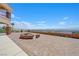 Expansive outdoor patio with a fire pit, providing ample space for relaxing and enjoying panoramic city views at 7192 Polita Ct, Las Vegas, NV 89156