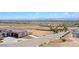 An elevated street view showcasing the house and neighborhood in the distance and a glimpse of the city skyline at 7192 Polita Ct, Las Vegas, NV 89156