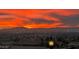Stunning sunset view showcasing a vibrant, illuminated sky over the city skyline and distant mountains at 7192 Polita Ct, Las Vegas, NV 89156