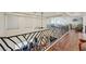 Upper landing with hardwood floors and an elegant railing at 7192 Polita Ct, Las Vegas, NV 89156