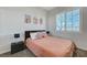 Bright bedroom with a comfortable bed and neutral decor at 7937 Base Camp Ave, Las Vegas, NV 89178