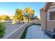 Private patio with view of landscaped grounds and golf course at 7976 Harbour Towne Ave, Las Vegas, NV 89113