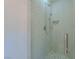 Clean shower with glass enclosure, modern fixtures, and hexagon tile floor at 7976 Harbour Towne Ave, Las Vegas, NV 89113