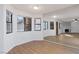 Bright dining area with wood flooring and large mirror at 1013 Falconhead Ln # 101, Las Vegas, NV 89128