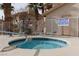 Community hot tub with surrounding lounge chairs at 1013 Falconhead Ln # 101, Las Vegas, NV 89128