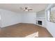 Living room with fireplace and ceiling fan at 1013 Falconhead Ln # 101, Las Vegas, NV 89128