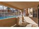 Covered patio overlooking the community pool at 1013 Falconhead Ln # 101, Las Vegas, NV 89128