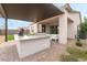 Outdoor kitchen and patio with built-in grill and pergola at 10262 Super Jovian St, Las Vegas, NV 89143