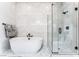 Luxurious bathroom featuring a soaking tub and walk-in shower at 10262 Super Jovian St, Las Vegas, NV 89143