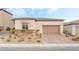 Single-story home with attached garage and landscaped front yard at 10262 Super Jovian St, Las Vegas, NV 89143