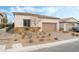 Single-story home with attached garage and landscaped front yard at 10262 Super Jovian St, Las Vegas, NV 89143