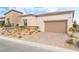 Single-story home with attached garage and landscaped front yard at 10262 Super Jovian St, Las Vegas, NV 89143