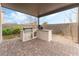 Outdoor kitchen with built-in grill and countertop at 10262 Super Jovian St, Las Vegas, NV 89143