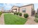 Artificial turf backyard with covered patio and gravel at 10270 Super Jovian St, Las Vegas, NV 89143