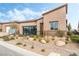 Modern single story home with neutral color palette and well manicured landscaping at 10270 Super Jovian St, Las Vegas, NV 89143