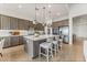 Spacious kitchen with island, stainless steel appliances, and light wood floors at 10270 Super Jovian St, Las Vegas, NV 89143