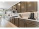 Kitchen with gray cabinets, quartz countertops and stainless steel appliances at 10270 Super Jovian St, Las Vegas, NV 89143