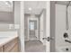 Bathroom with access to laundry room and tub at 10597 Painted Bridge St, Las Vegas, NV 89179