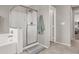 Bathroom featuring a walk-in shower and linen closet at 10597 Painted Bridge St, Las Vegas, NV 89179