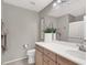 Clean bathroom with double vanity and toilet at 10597 Painted Bridge St, Las Vegas, NV 89179