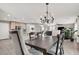 Formal dining room features a chandelier and hardwood flooring at 10597 Painted Bridge St, Las Vegas, NV 89179