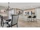 Bright dining area with a wood table and chandelier at 10597 Painted Bridge St, Las Vegas, NV 89179