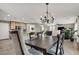 Bright dining area with wood table and chandelier at 10597 Painted Bridge St, Las Vegas, NV 89179