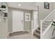 Bright entryway with staircase and neutral color scheme at 10597 Painted Bridge St, Las Vegas, NV 89179