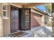 Dark brown front door and entryway at 10597 Painted Bridge St, Las Vegas, NV 89179